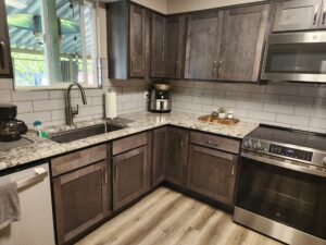 Kitchen sink and new appliances after rehab