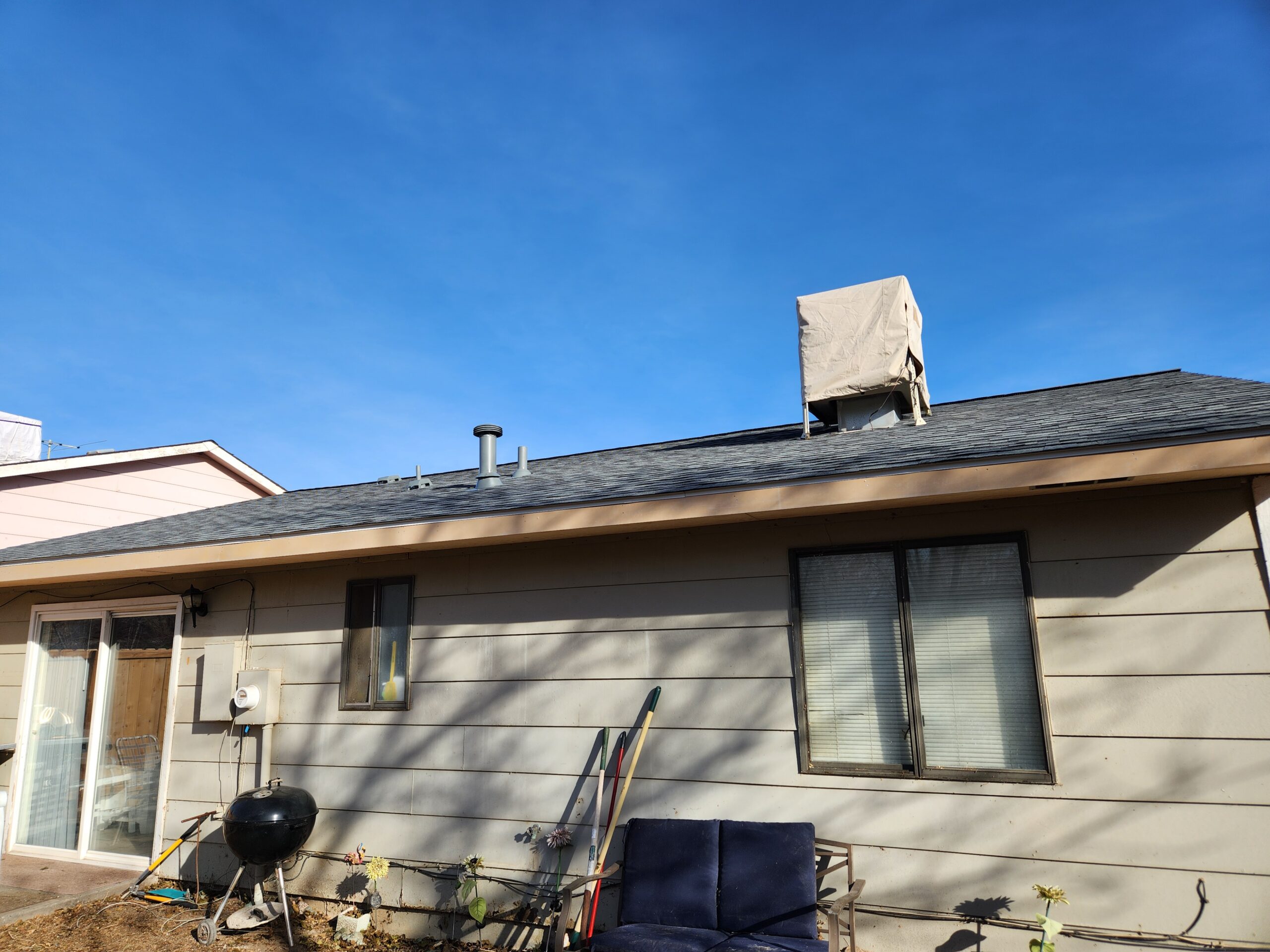 A photo of a brown home before repairs